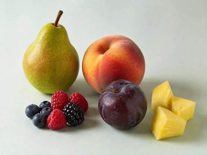 Pear, peach, berries, plum and pineapple representing fruity notes in perfume