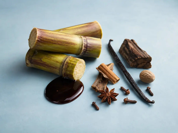 Sugarcane, molasses, oakwood, vanilla and spices representing a warm rum perfume accord