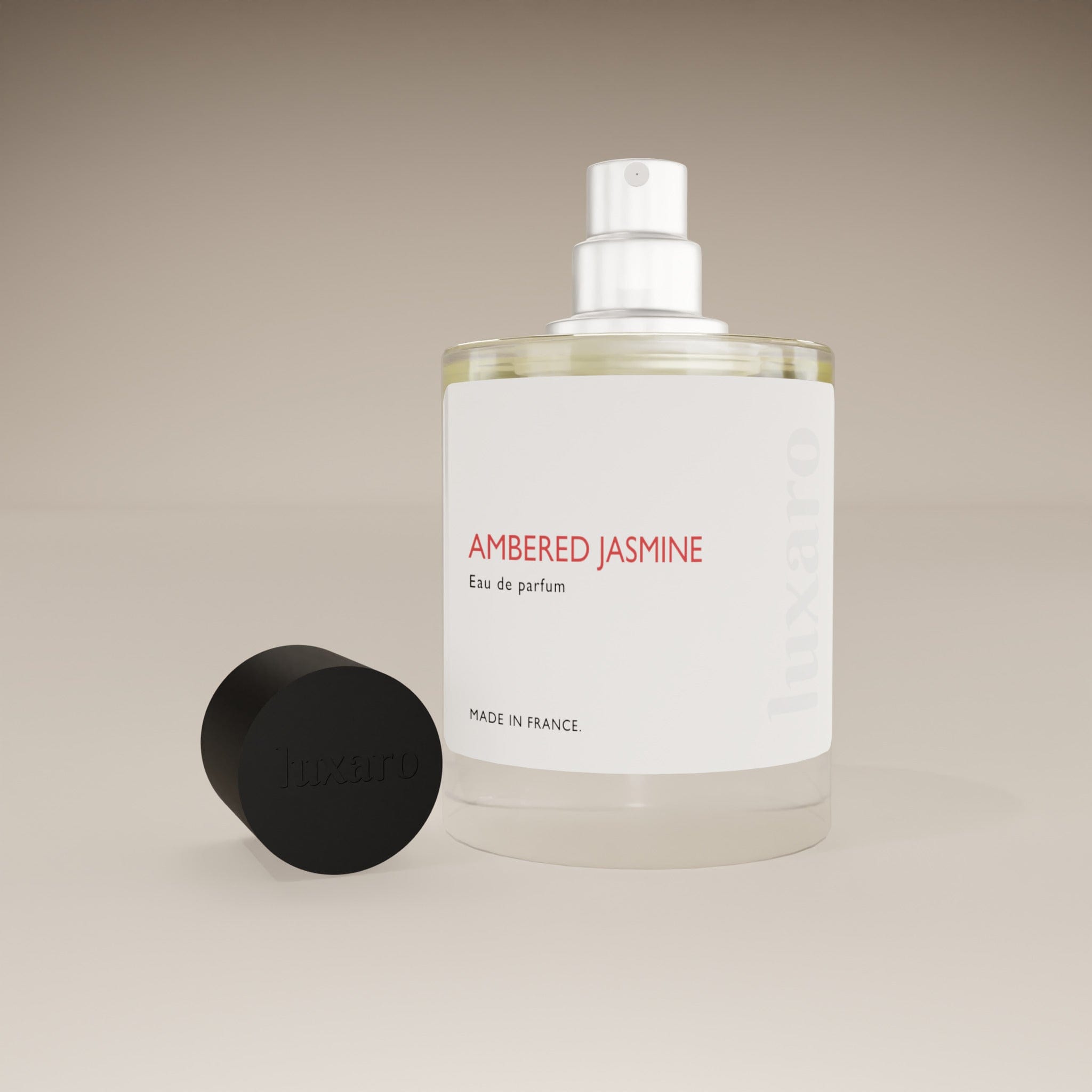 Luxaro Ambered Jasmine perfume bottle with cap removed, showing the fragrance inside, inspired by Carolina Herrera’s Good Girl