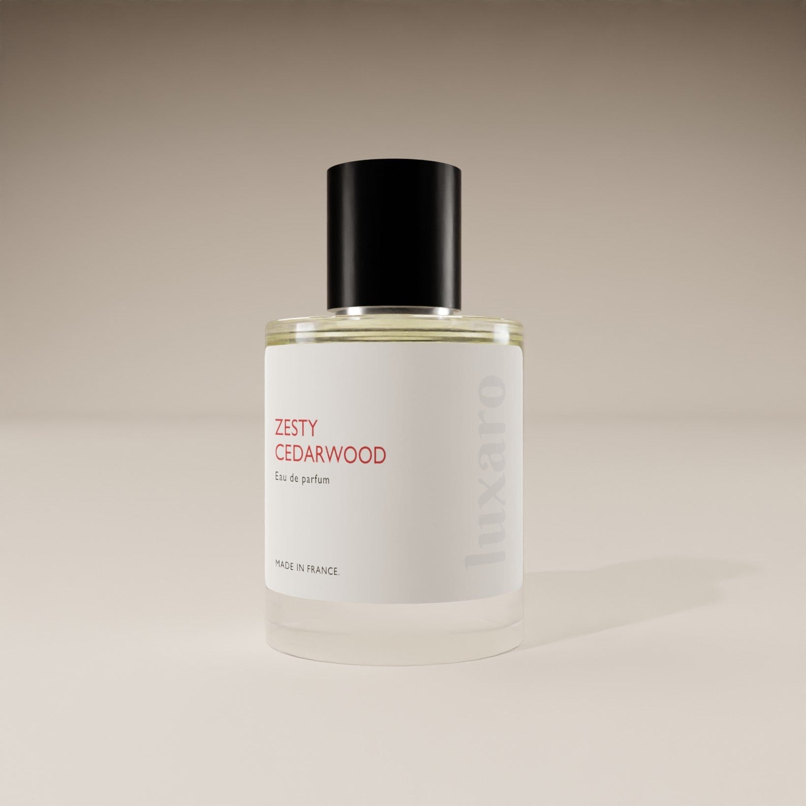 Luxaro Zesty Cedarwood perfume bottle, inspired by Hermès's Eau Des Merveilles, featuring orange, amber, and cedar notes