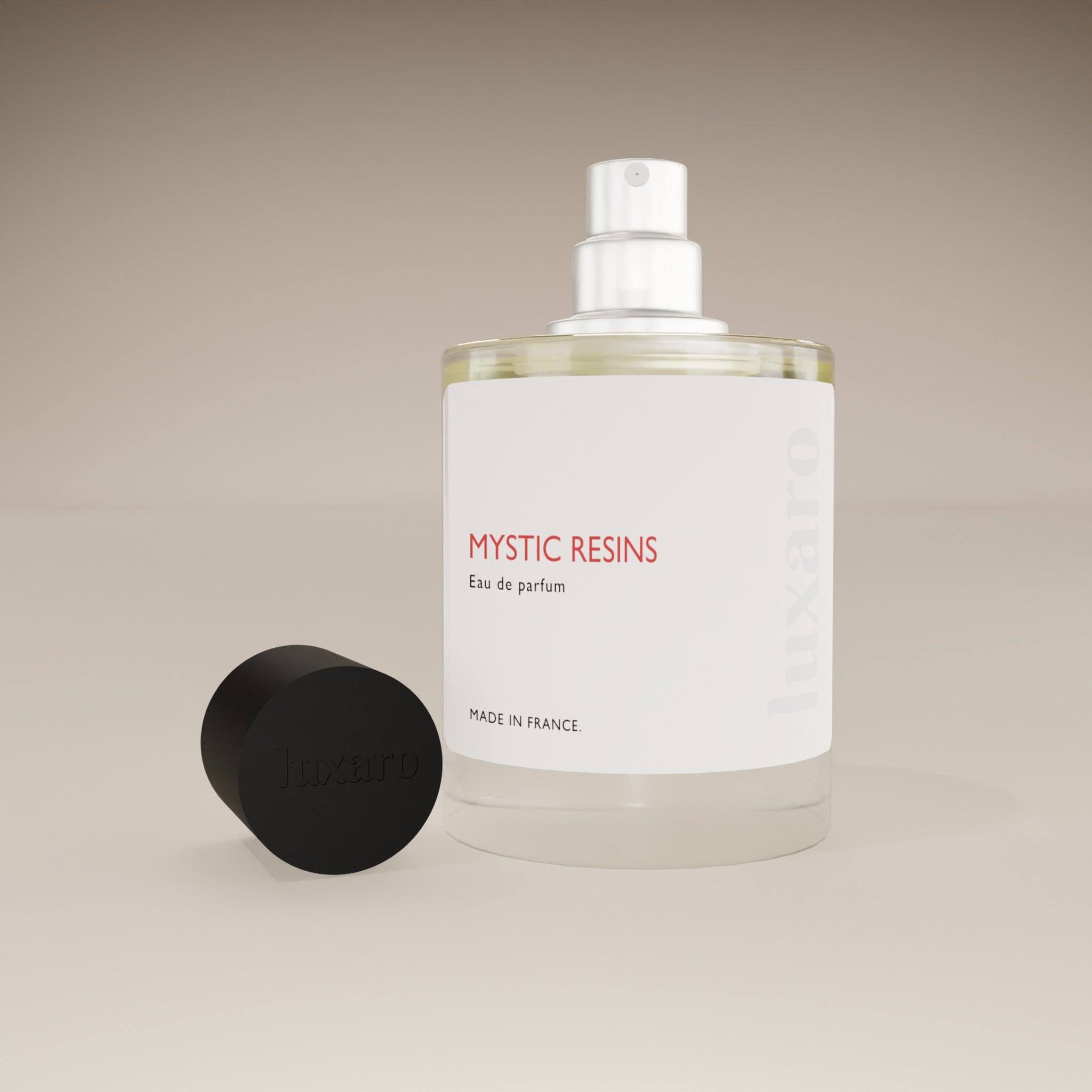 Luxaro Mystic Resins perfume bottle with cap removed, revealing the intense, resinous fragrance inside, inspired by Tom Ford's Myrrhe Mystère