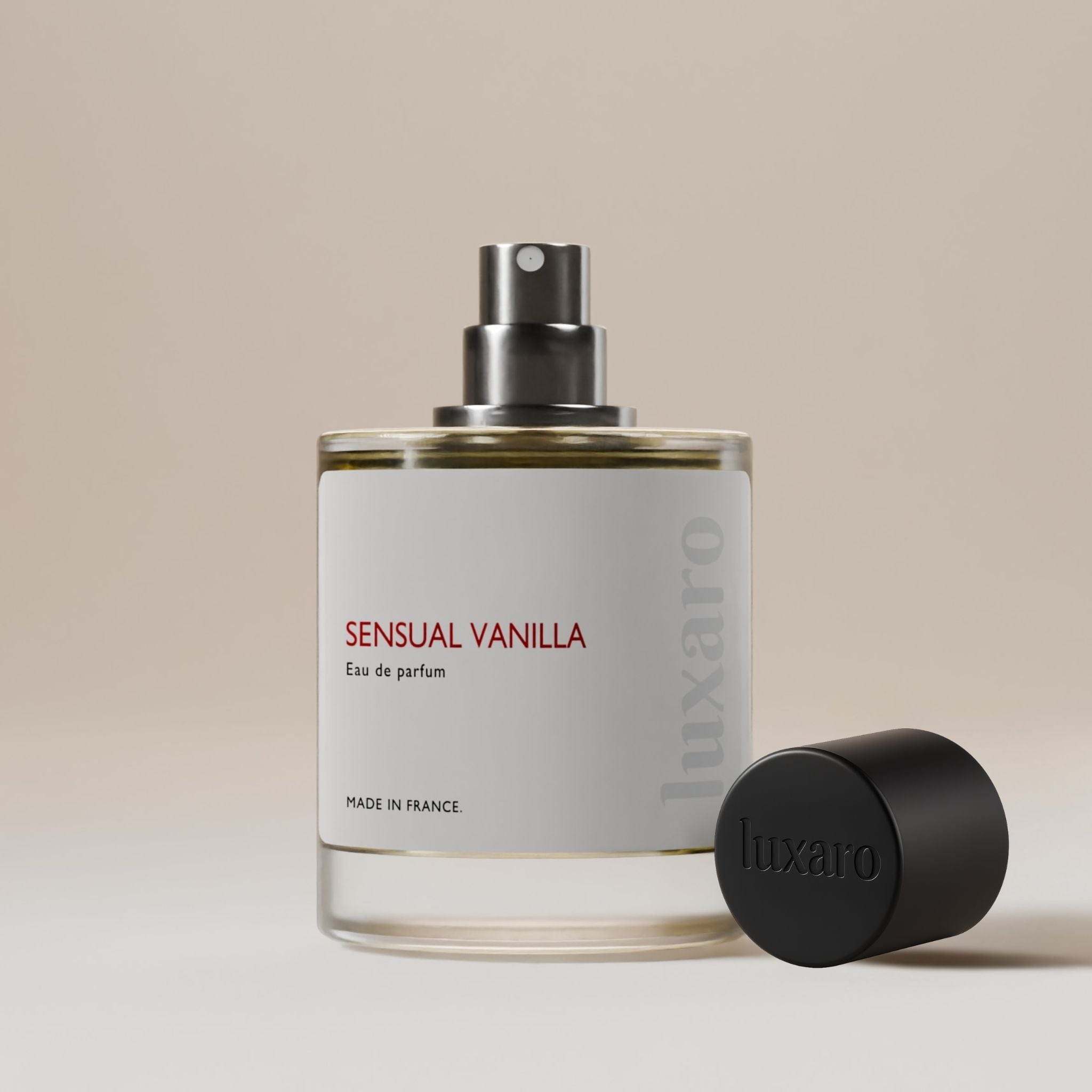 Luxaro Sensual Vanilla perfume bottle with cap removed, revealing the floral fragrance inside, inspired by Black Opium dupe – featuring notes of pear, coffee,vanilla, jasmine, and cedar, luxury fragrance alternative made in France.