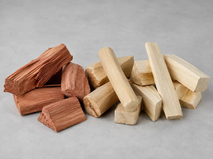 Cedarwood, sandalwood and pale natural wood pieces on a light mist grey background
